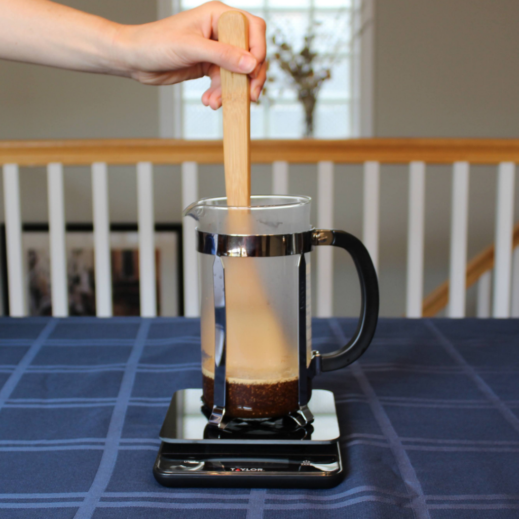 French press coffee bloom - stir with a wooden spoon and wait 30-45 second