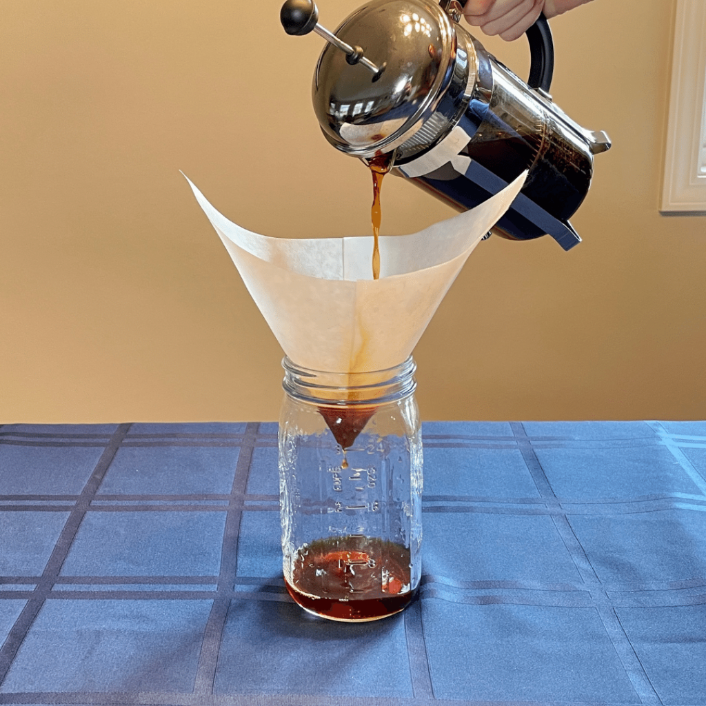 cold brew coffee: strain into mason jar