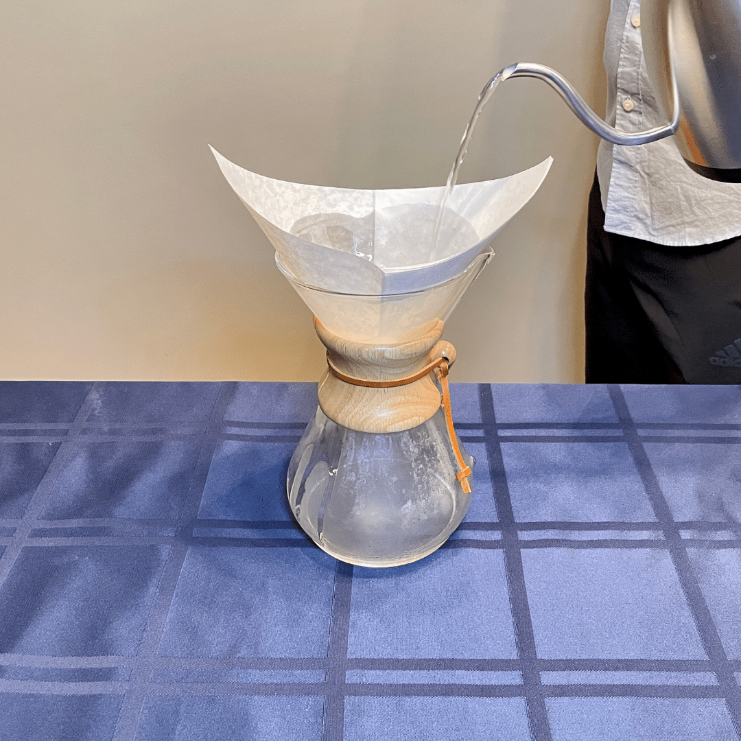 wetting the filter for a Chemex pour over coffee