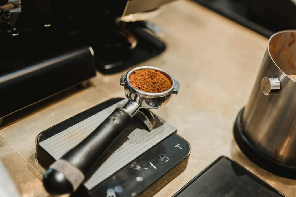 espresso portafilter with coffee on a scale