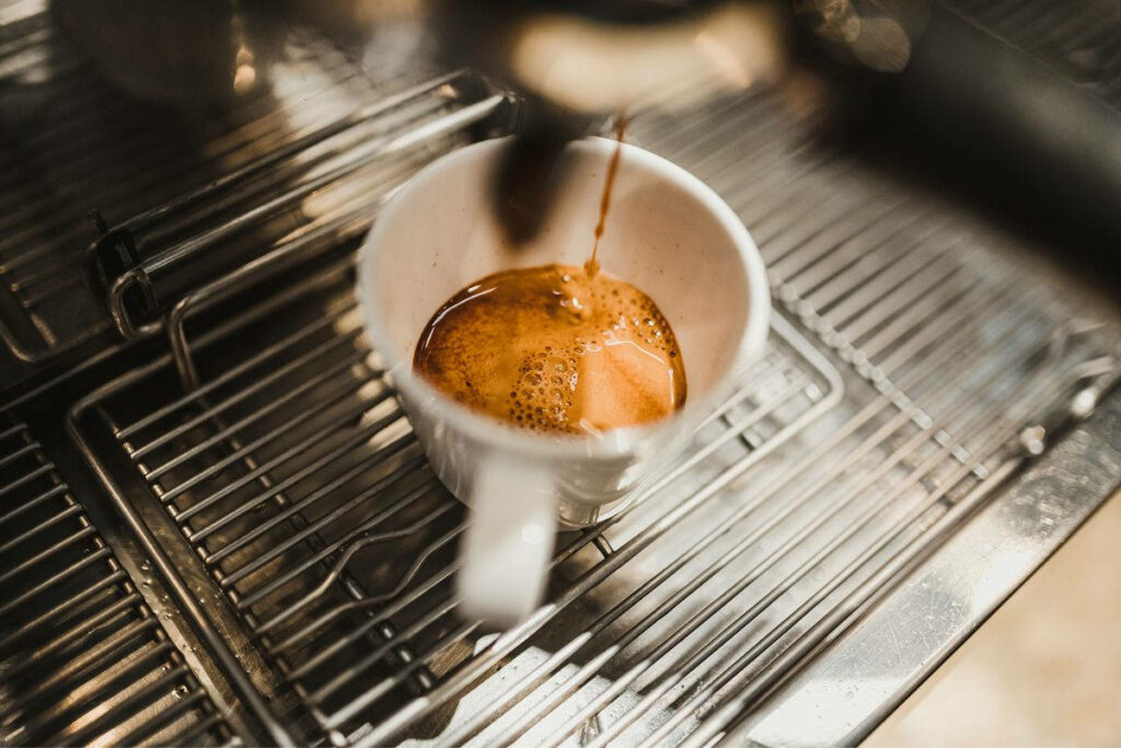 espresso shot pouring with a thick crema