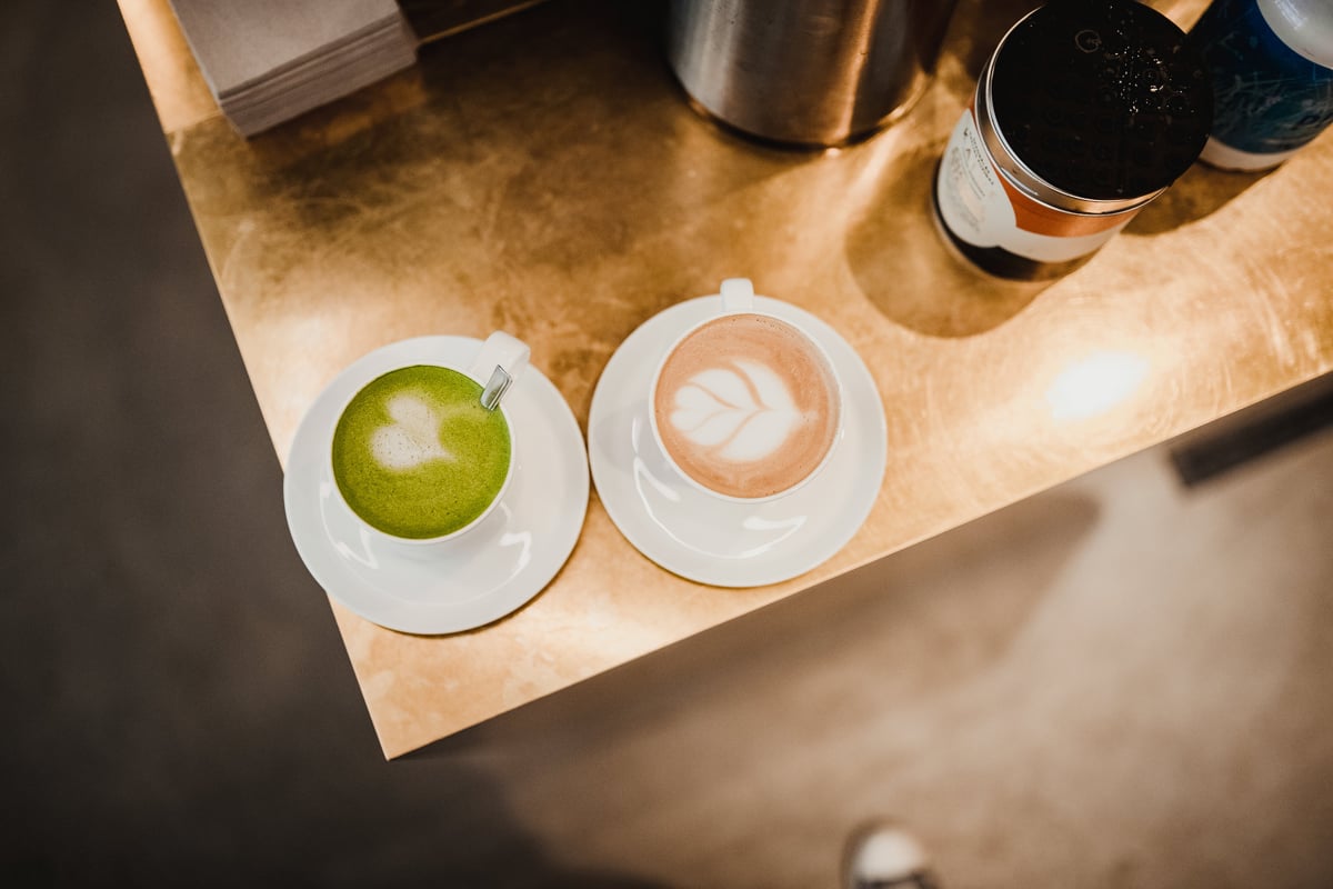 Cups of Matcha Latte and Latte